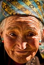 Portrait of an old smiling woman from Tibet