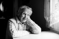 Portrait of an old woman. Black and white contrast photo. Royalty Free Stock Photo