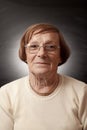 Portrait of old woman in dark background Royalty Free Stock Photo