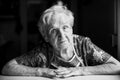 Portrait of an old woman in her home. Black and white photo. Royalty Free Stock Photo