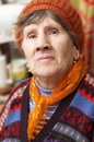 Portrait of old woman in red beret