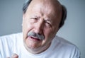 Close up portrait of sad old man face suffering from depression Royalty Free Stock Photo