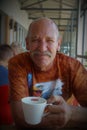 Portrait of an older man drinking coffee, Newmarket Mall, Alberton