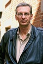 Portrait of older man outside looking stern