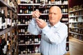 Portrait of older man tasting red wine Royalty Free Stock Photo