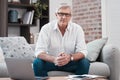 No need to recognise the road ahead. Portrait of an older man using his laptop while sitting on the couch at home. Royalty Free Stock Photo