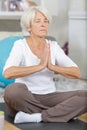 portrait older woman in sportswear exercising at home Royalty Free Stock Photo