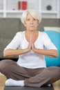 portrait older woman in sportswear exercising indoors Royalty Free Stock Photo