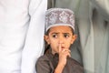 Portrait of an Omani boy in a traditional Omani dress. Nizwa, Oman - 15/OCT/2016