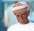 Portrait of an Omani man in a traditional Omani dress. Nizwa, Oman - 15/OCT/2016 Royalty Free Stock Photo