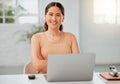 Portrait of one confident young hispanic business woman working on a laptop in an office. Happy entrepreneur browsing Royalty Free Stock Photo