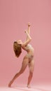 Portrait of one emotional young girl with silk hair wearing beige underwear posing over pink studio background. Hair Royalty Free Stock Photo