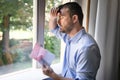 Sad businessman reading pink slip job termination Royalty Free Stock Photo