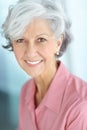 Portrait of one happy senior caucasian woman with grey hair enjoying free time at home. Face of carefree, wise and Royalty Free Stock Photo