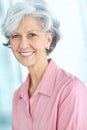 Portrait of one happy senior caucasian woman with grey hair enjoying free time at home. Face of carefree, wise and Royalty Free Stock Photo