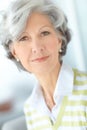 Portrait of one happy senior caucasian woman with grey hair enjoying free time at home. Face of carefree, wise and Royalty Free Stock Photo