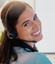 Portrait of one happy young smiling caucasian call centre telemarketing agent talking on headset in office. Face of Royalty Free Stock Photo