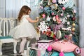 Portrait of one little Caucasian cute blonde girl in the festive New year studio room Royalty Free Stock Photo