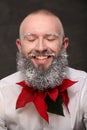 Portrait of one man with painted long beard in white