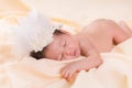 Newborn baby girl wearing angel wing