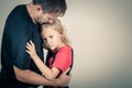 Portrait of one sad daughter hugging her father Royalty Free Stock Photo