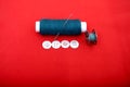 Portrait of one sewing thread, needle, bobbin and button Royalty Free Stock Photo