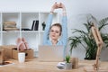 portrait of online shop proprietor resting during work