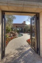 Open gate with path leading to front door