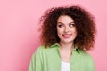 Portrait of optimistic nice girl with wavy hairdo wear green shirt look at proposition empty space isolated on pink Royalty Free Stock Photo