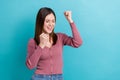 Portrait of optimistic satisfied woman stylish hairstyle wear pink shirt clenching fists win lottery isolated on blue Royalty Free Stock Photo