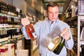 Portrait of ordinary man buying wine Royalty Free Stock Photo