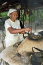 Portrait of outdoor cooking senior woman, Brazil