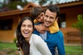 Portrait, outdoor and family with happiness, funny and bonding with joy, laughing and loving. Face, parents and mother Royalty Free Stock Photo