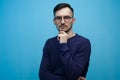 Portrait of an outraged young man in glasses