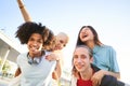 Portrait outside of multiracial friends group. Happy people smiling at camera. Human resources, multicultural Royalty Free Stock Photo