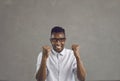 Portrait of overjoyed african american man with clenched fist feeling excited