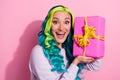 Portrait of overjoyed good mood lady receive present on her birthday isolated on pink color background Royalty Free Stock Photo