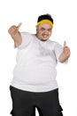 Overweight man showing thumbs up on studio Royalty Free Stock Photo