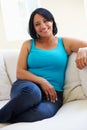 Portrait Of Overweight Woman Sitting On Sofa Royalty Free Stock Photo