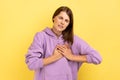Woman frowning suffering sudden heart attack, myocardial infarction, risk of breast. Royalty Free Stock Photo