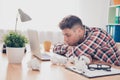 Portrait of overworked young handsome manager sleeping in office Royalty Free Stock Photo