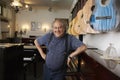 Portrait Of Owner Leaning In Music Store