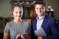 Portrait Of Owner With Waitress In Restaurant