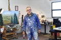 Portrait of a painter artist who works in his studio