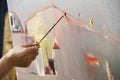 Portrait of painter using brush to paint