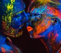 Portrait of a pair of lovers painted in fluorescent powder.