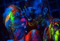 Portrait of a pair of lovers painted in fluorescent powder.