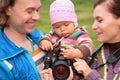 Portrait of parents with baby with photocamera Royalty Free Stock Photo