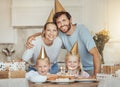 Portrait of parents, girl children and birthday cake for celebration with candles, love and sweets in home. Happiness Royalty Free Stock Photo