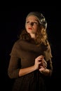 Portrait of parisian,self-assured,serious,confident,proud,high-minded girl with red lips and grey beret,brown dress.Vintage style